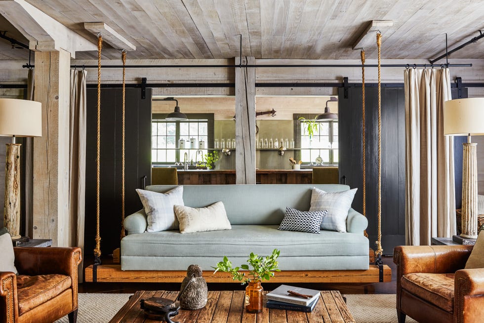 porch swing sofa in the family room of the tennessee party barn of lauren akins and thomas rhett