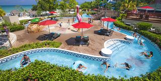 a pool area complete with lazy river at beaches negril, a good housekeeping pick for best family vacation destination