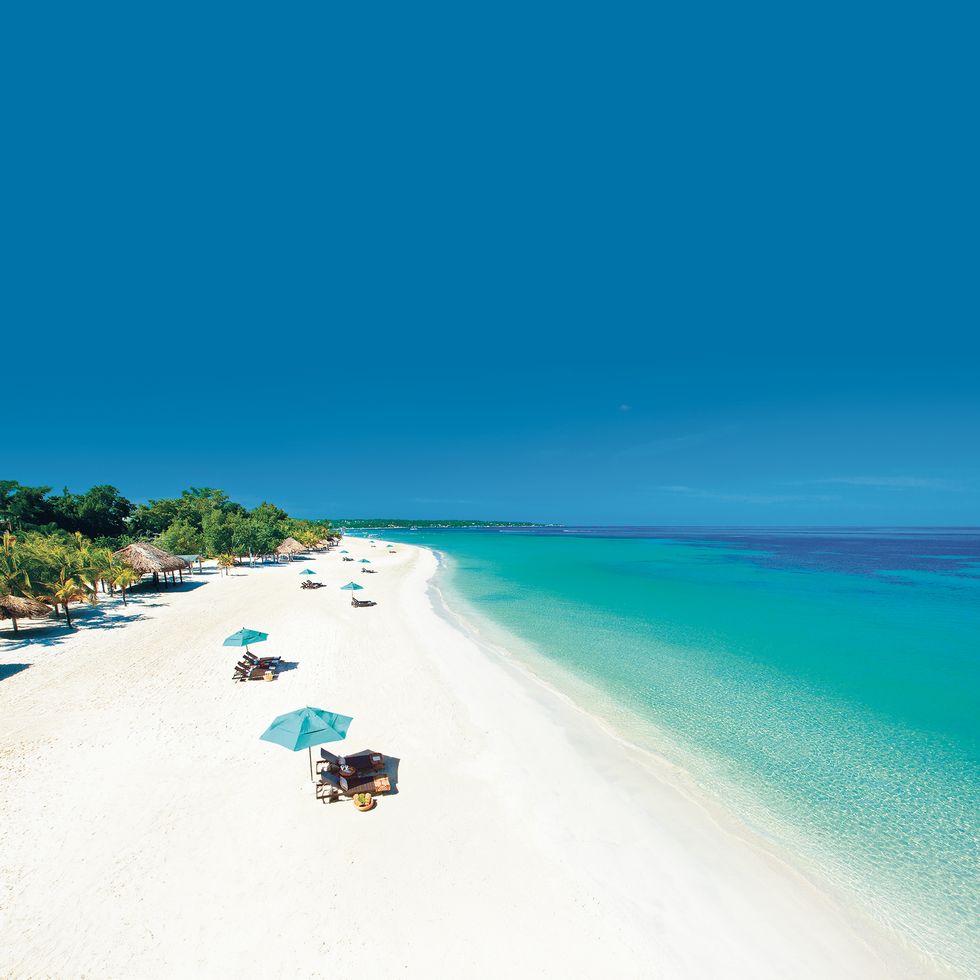 a sparsely attended white sand beach at beaches negril, a good housekeeping pick for best family vacation destinations