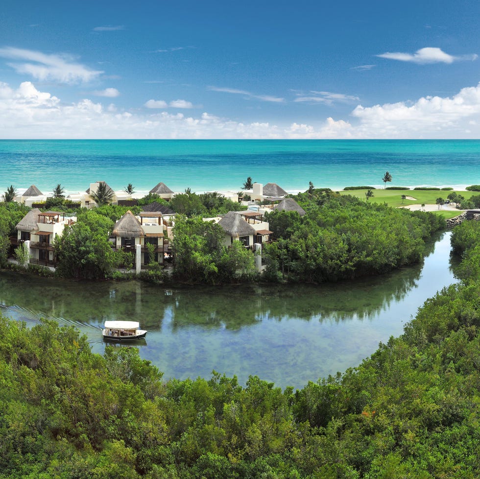 An aerial view of the beach at Fairmont Mayakoba, a Good Housekeeping pick for best family resort an aerial view of the beach at fairmont mayakoba, a good housekeeping pick for best family resort