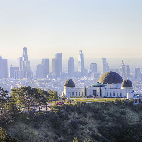 morning scenery of griffith observatory and downtown la los angeles is good housekeeping pick for best family vacation destinations
