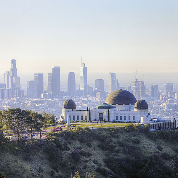 morning scenery of griffith observatory and downtown la los angeles is good housekeeping pick for best family vacation destinations
