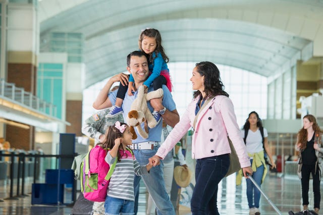 family walking in airport