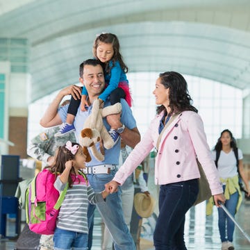 Family walking in airport family walking in airport