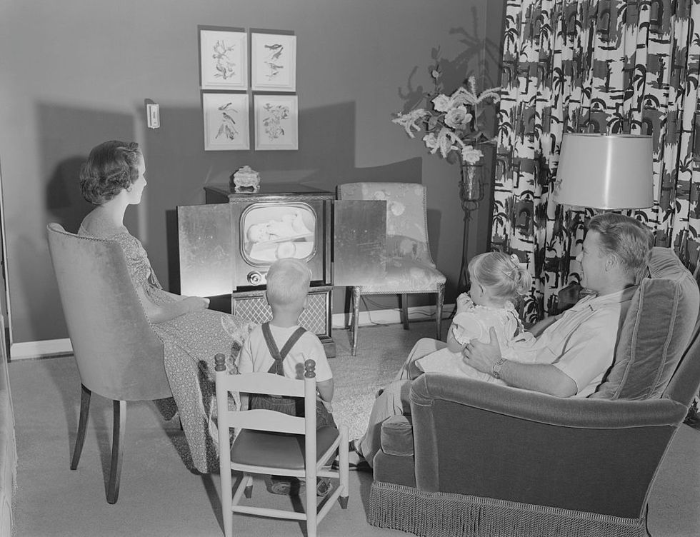 family watching television in living room