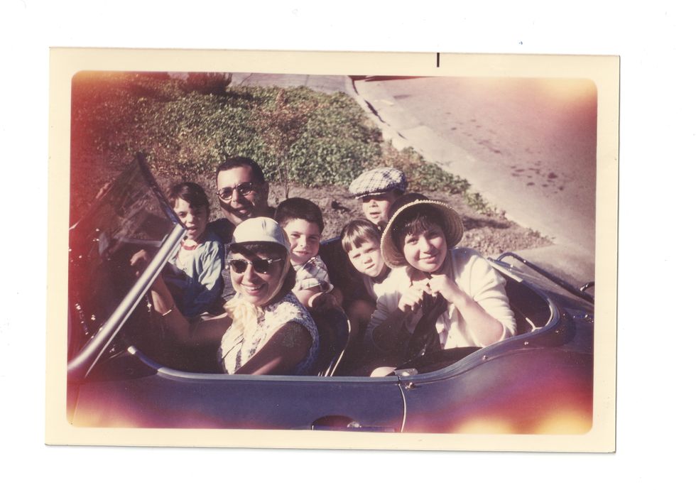 vintage photo of family in sports car