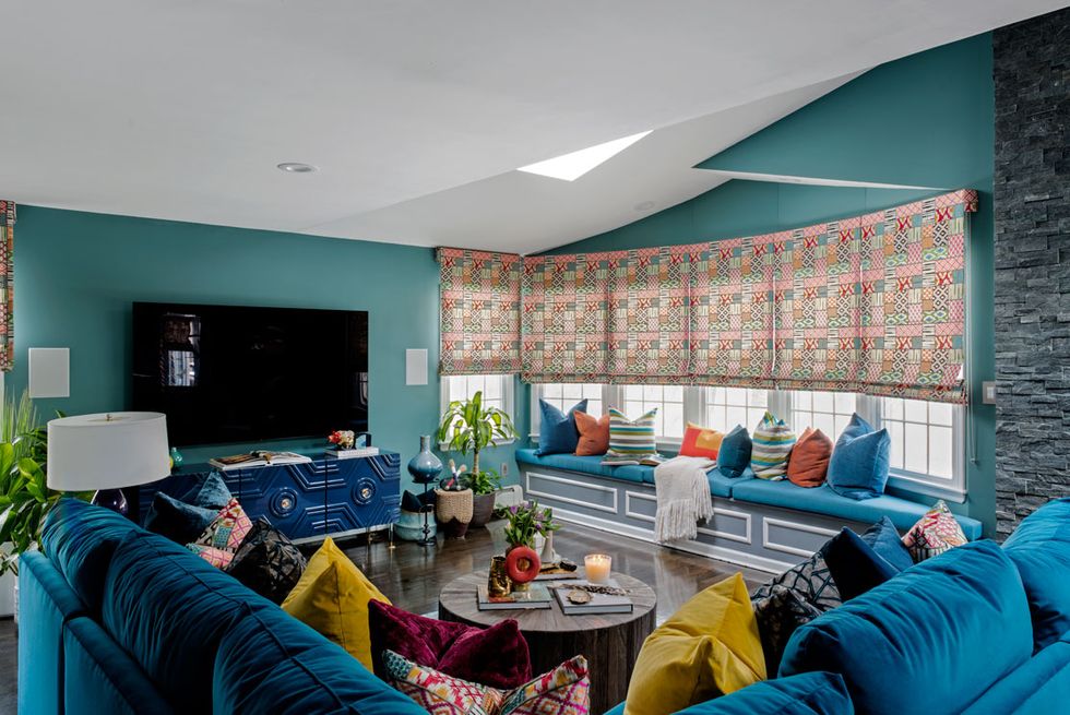 large teal living room with tv 
