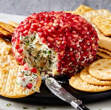 fancy christmas cheese ball covered in fresh pomegranate seeds