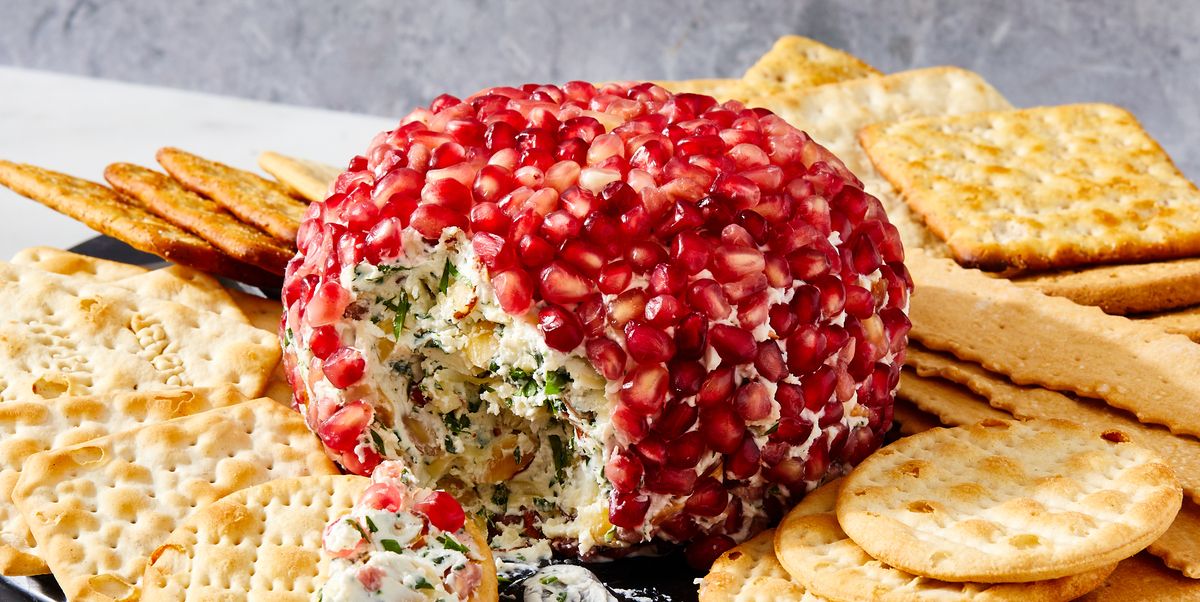 fancy christmas cheese ball covered in fresh pomegranate seeds