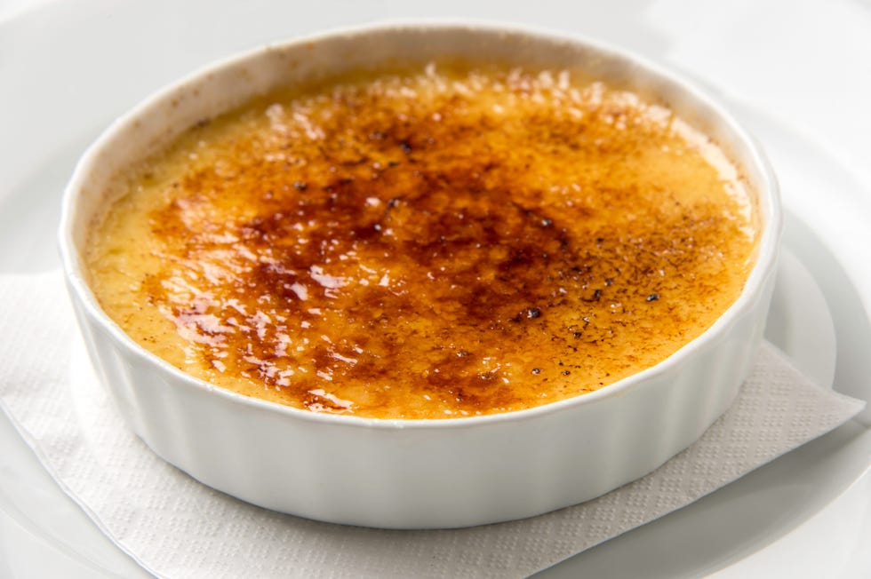 Fancy picture of a crème brulee standing on a napkin
