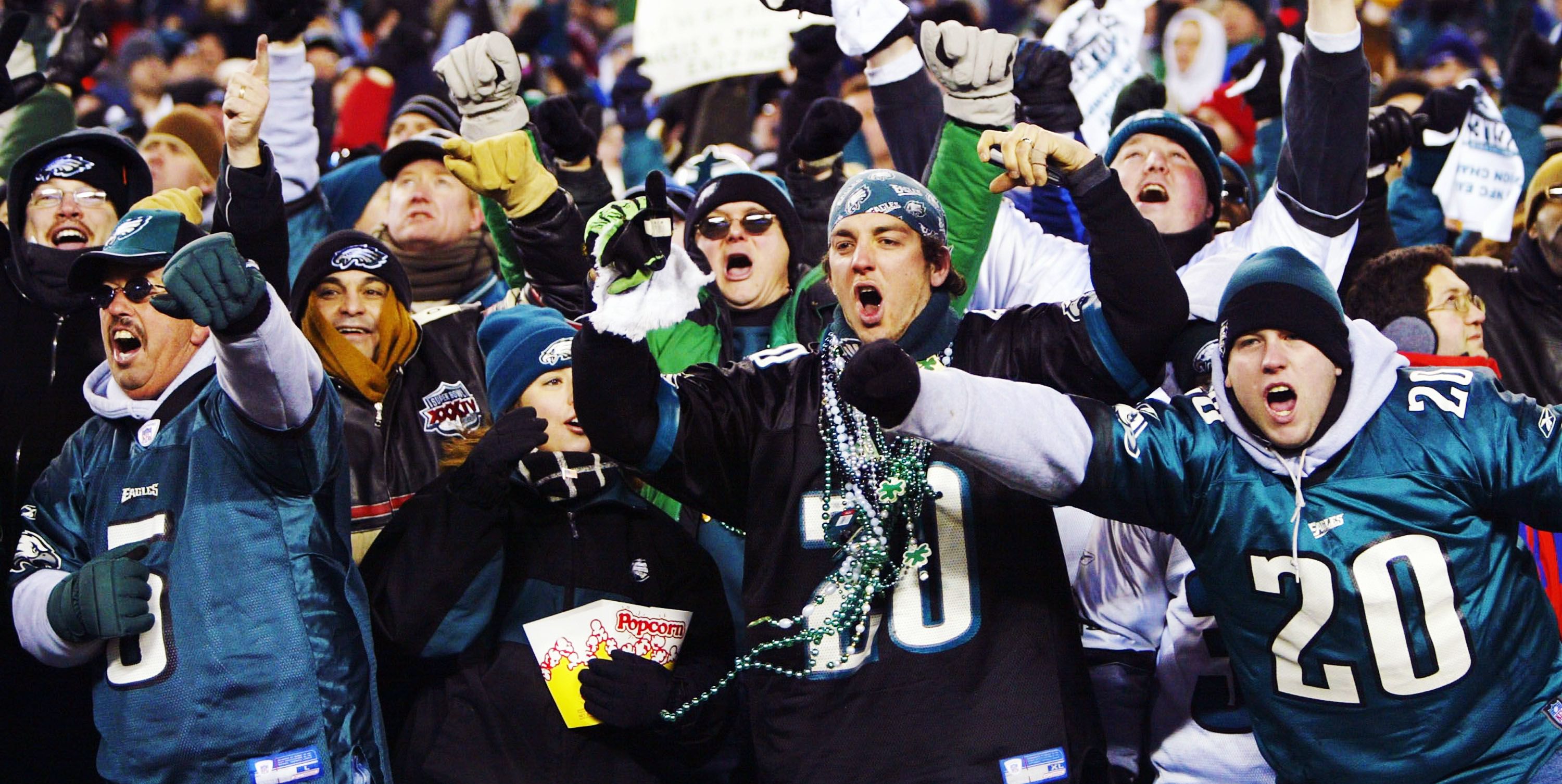 Every underdog needs a beer break. An Eagles fan wearing a…