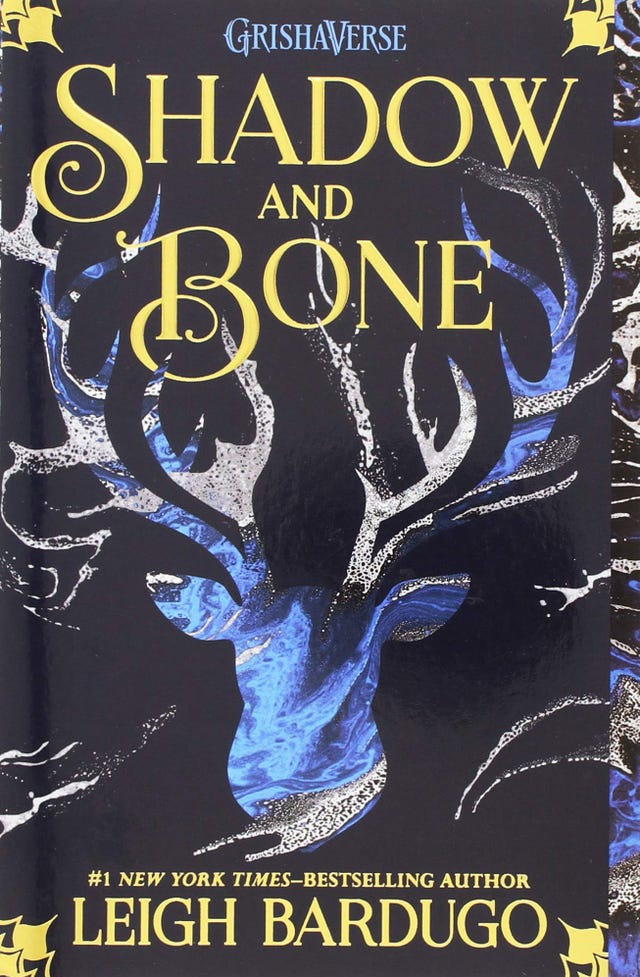 https://hips.hearstapps.com/hmg-prod/images/fantasy-books-shadow-and-bone-1555433254.jpg?crop=1.00xw:0.329xh;0,0.0640xh&resize=640:*