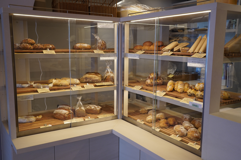 a bakery case with various pastries
