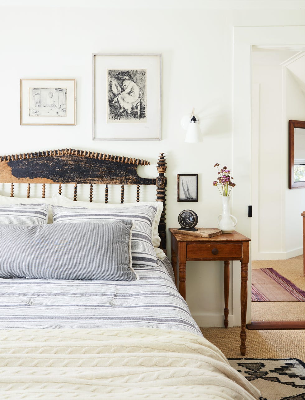 a rustic bedroom design with a black vintage spool bed