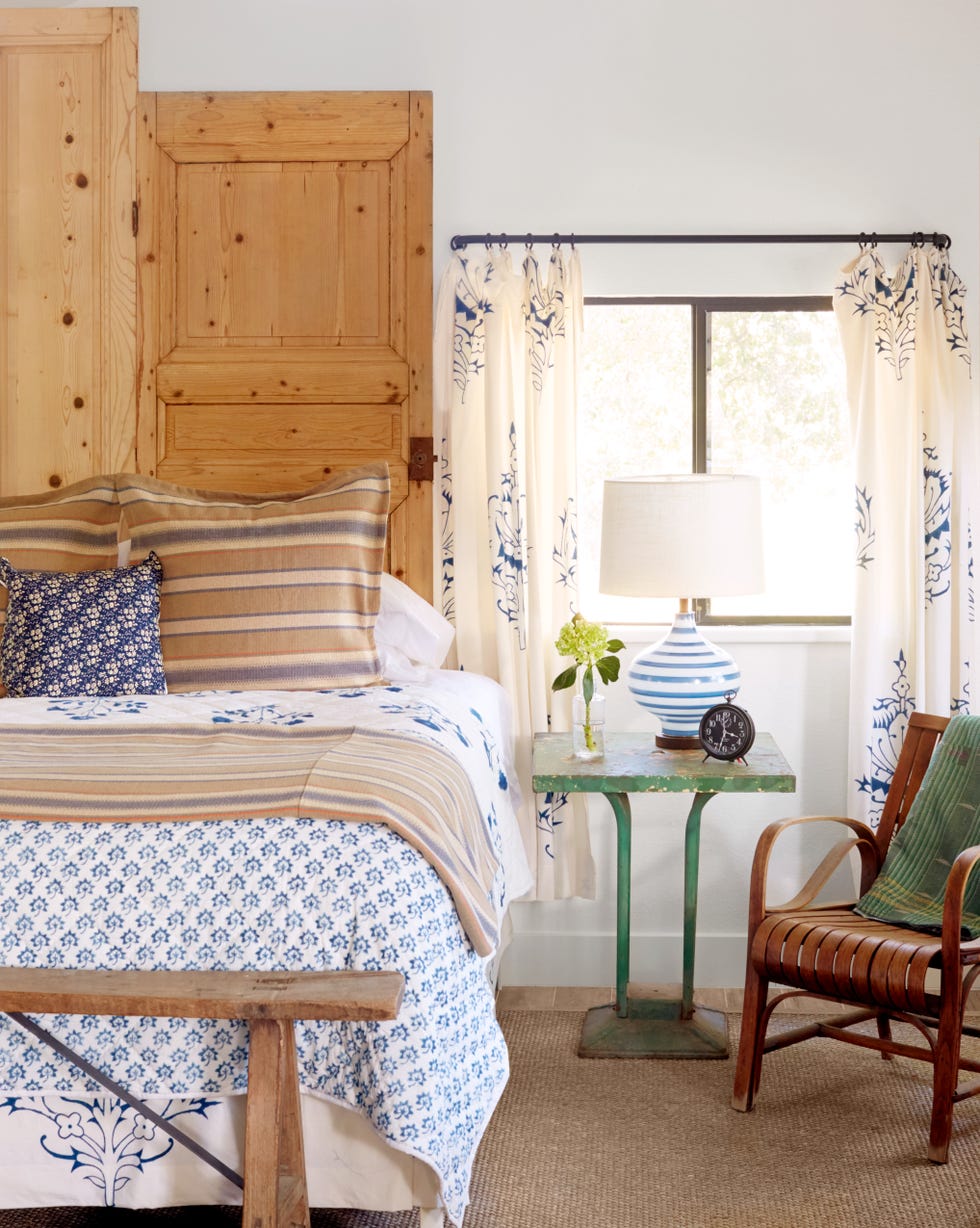 farmhouse bedroom with french doors as headboard