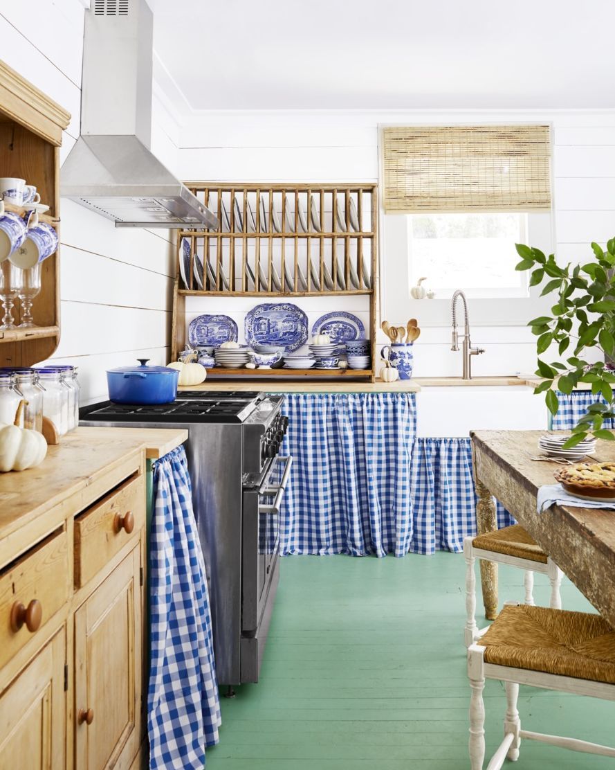 farmhouse kitchen with blue gingham fabric skirting the cabinetry and sink