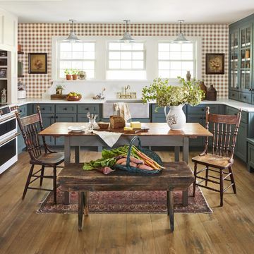 farmhouse kitchen of north carolina homeowner ronnie thompson with green cabinets and gingham wallpaper