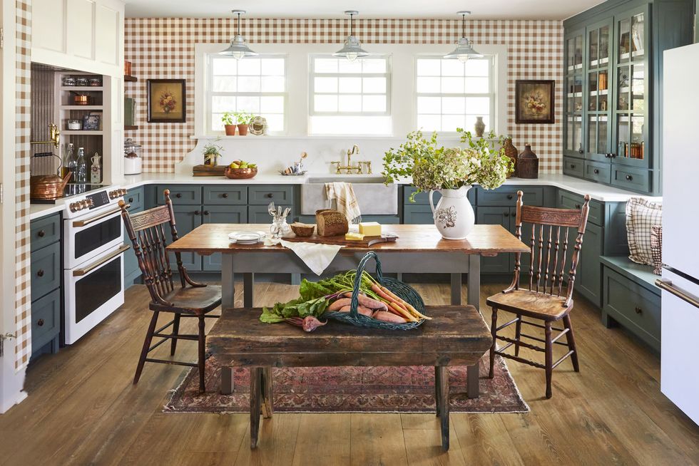 farmhouse kitchen of north carolina homeowner ronnie thompson with green cabinets and gingham wallpaper
