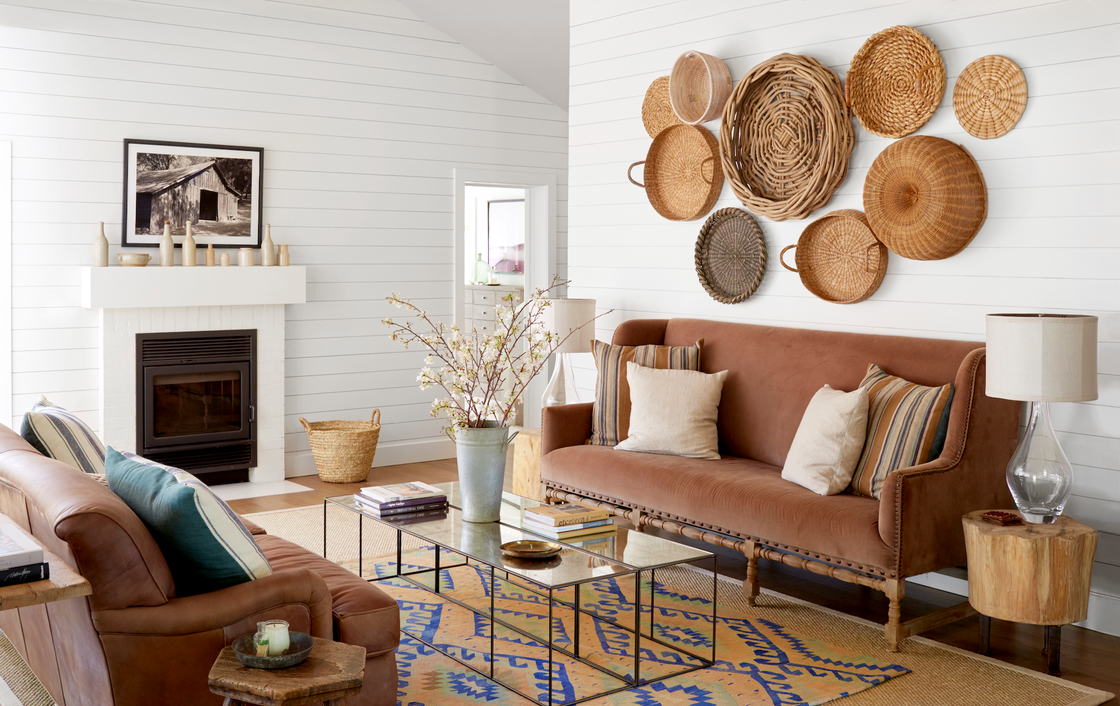 farmhouse living room with baskets on the wall