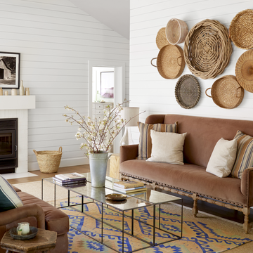 farmhouse living room with baskets on the wall