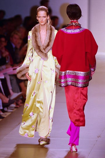 two models wearing silk robe and coat on the runway