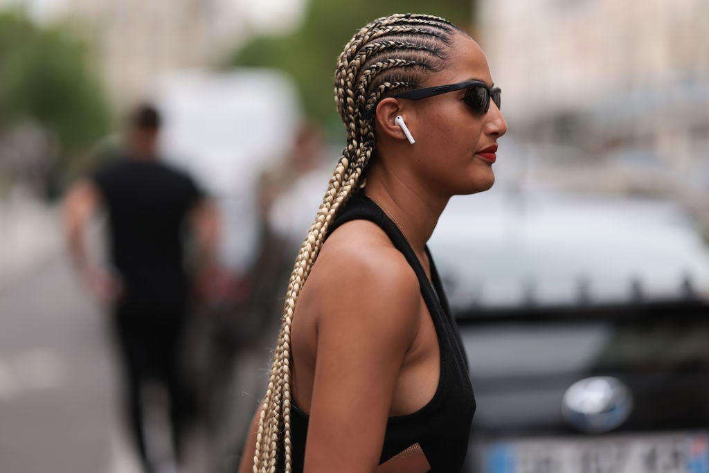 fashion show guest is seen wearing black and green news photo