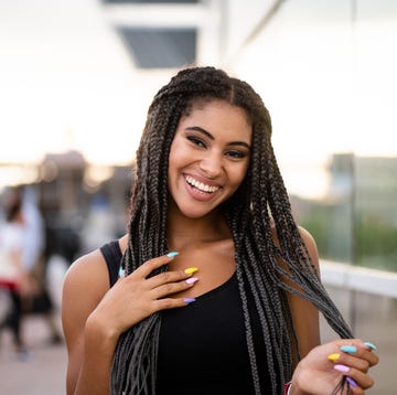 fashionable young model with colorful nail paint