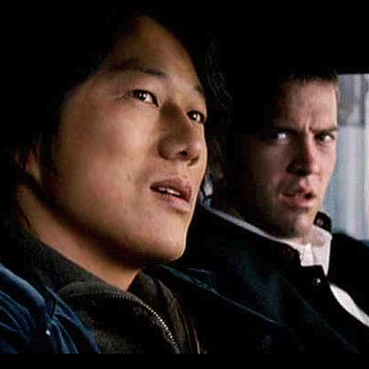 sung kang as han and lucas black as sean drive around in a scene from the fast and the furious tokyo drift