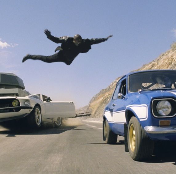 tyrese as roman jumps to a car in a scene from fast and furious 6