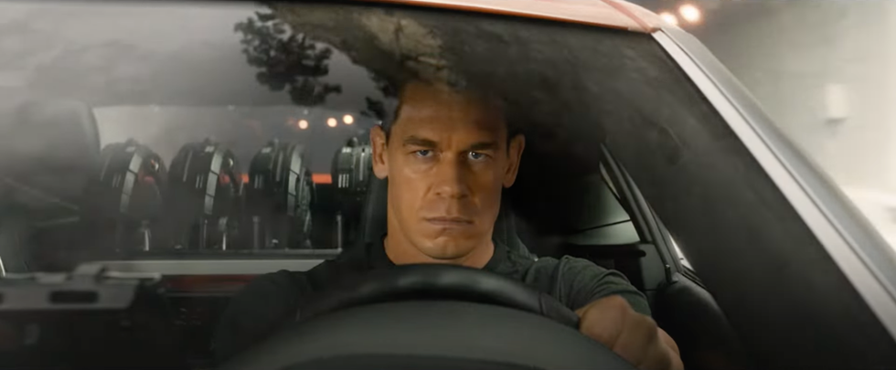 john cena pictured behind the wheel of a car in f9 – fast and furious trailer