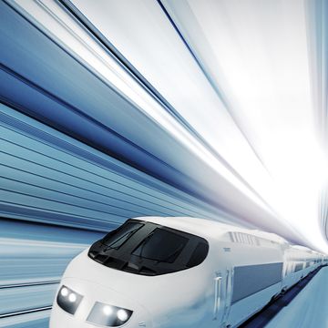 a fast modern train speeding through a tunnel