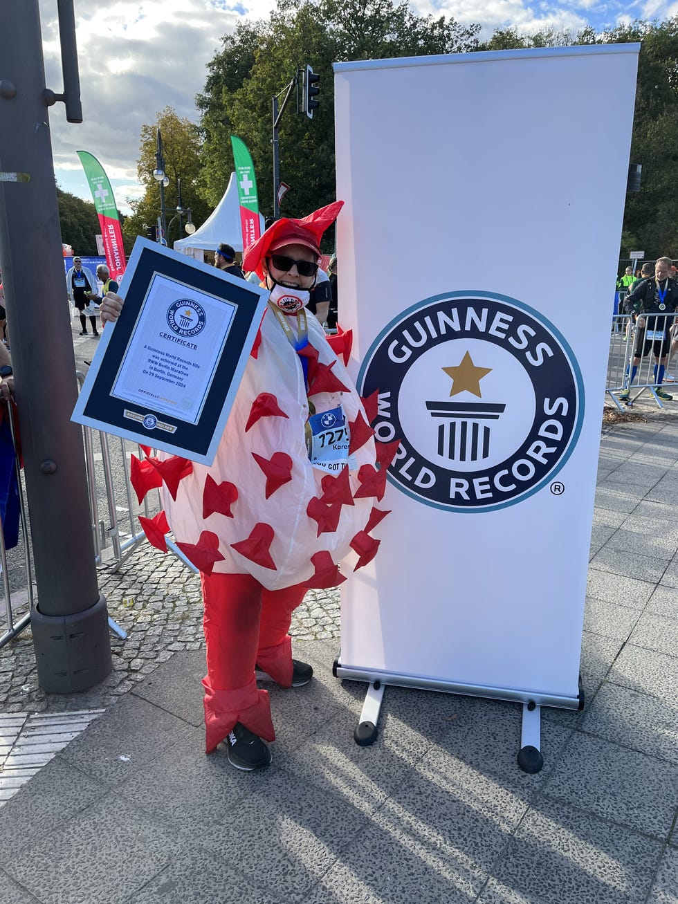 karen michelsen, who dressed up as a coronavirus to become the fastest female to run a marathon in an inflatable costume