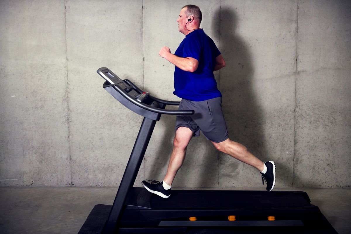 Fat Man Running on Treadmill