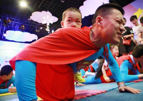 children feed fathers milk on father's day in hangzhou