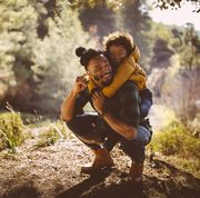 what to do for father's day kneeling dad with child on his back outdoors in nature father's day activities