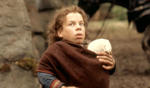 willow ufgood holds a baby in a scene from willow