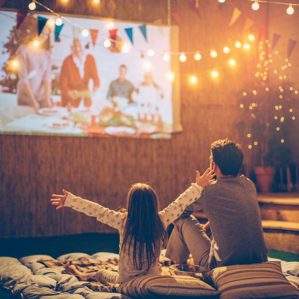 what to do for father's day dad and daughter watching movie in the backyard