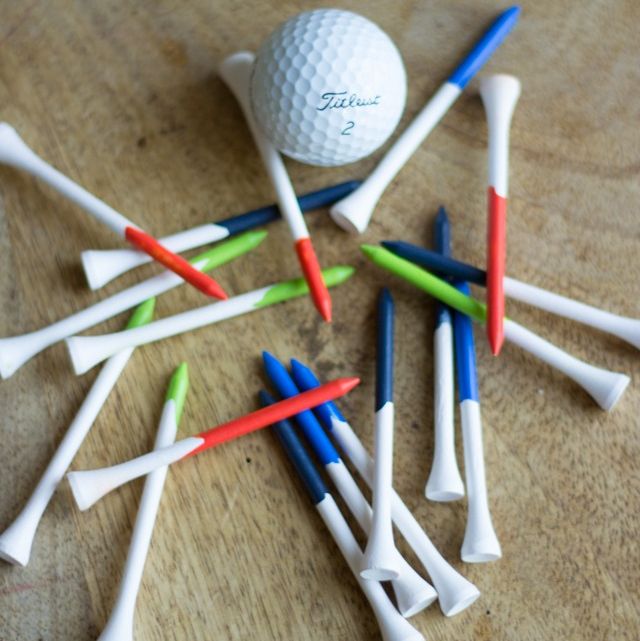 A pile of hand-drawn golf tees surrounding a golf ball