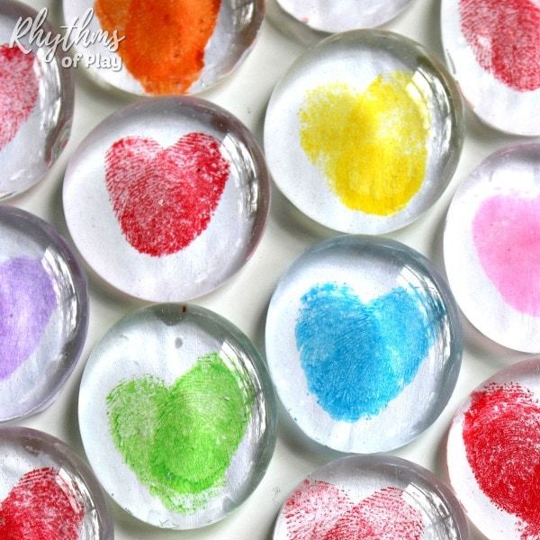 round clear magnets with colored thumbprint hearts