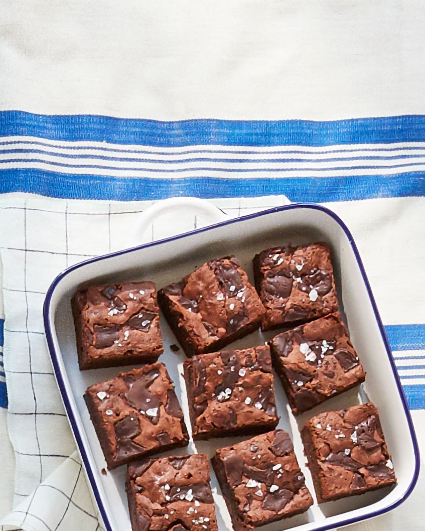 fudgy stout brownies in a tray on a picnic blanket