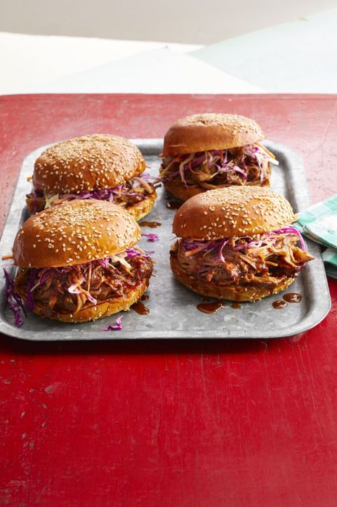 spicy dr pepper shredded pork on hamburger buns with coleslaw on metal tray