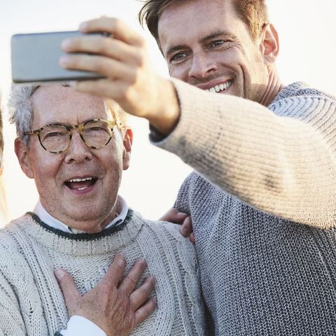 father son taking selfie for instagram