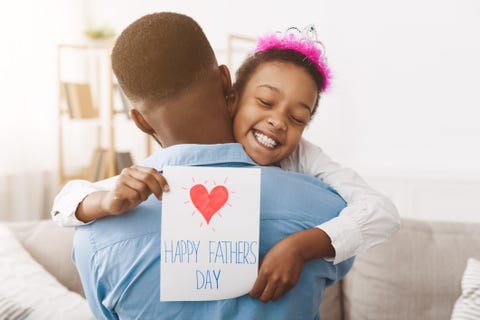father's day pretty girl giving dad postcard