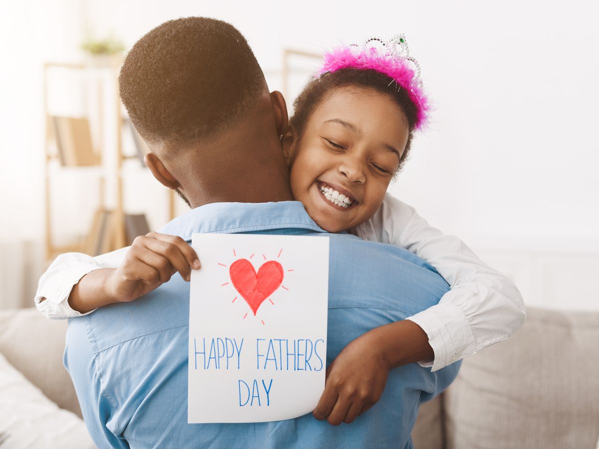 https://hips.hearstapps.com/hmg-prod/images/fathers-day-pretty-girl-giving-dad-postcard-royalty-free-image-1681669345.jpg?crop=0.88889xw:1xh;center,top&resize=1200:*