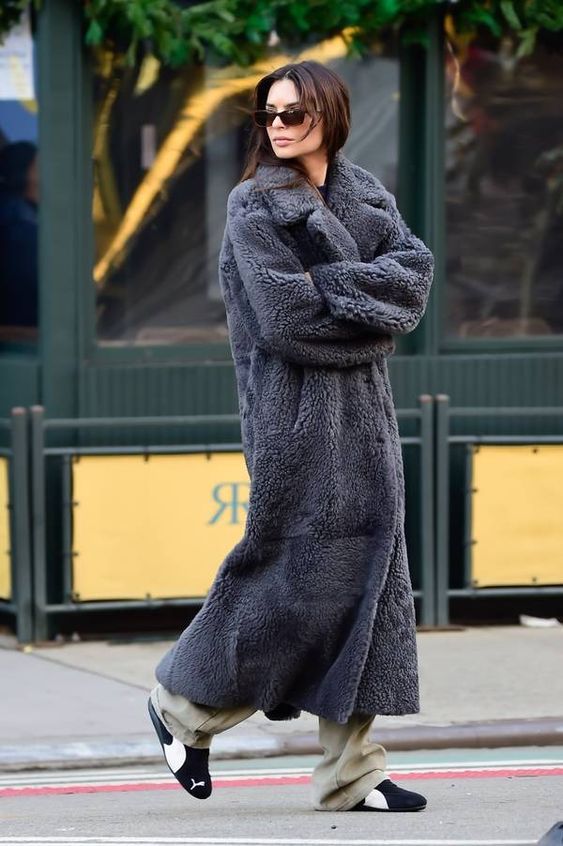 a woman in a long coat