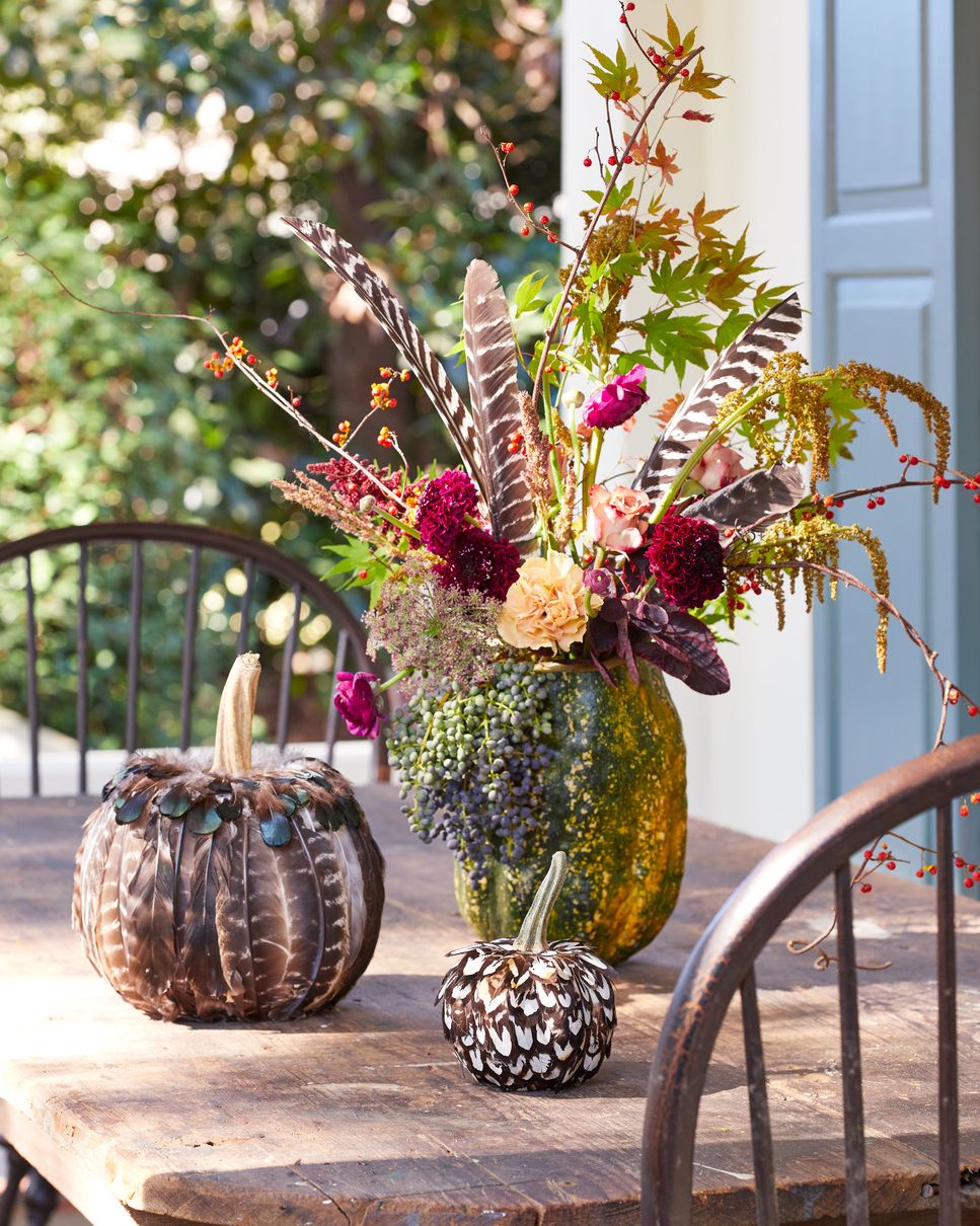 floral centerpieces in pumpkin vases halloween decor
