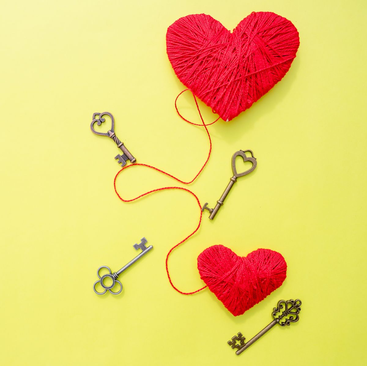 14 february, Keys with the heart as a symbol of love. Greeting card with red heart on yellow background. Valentines day background. Key of my heart concept. path to heart. Valentines Day.Copy space