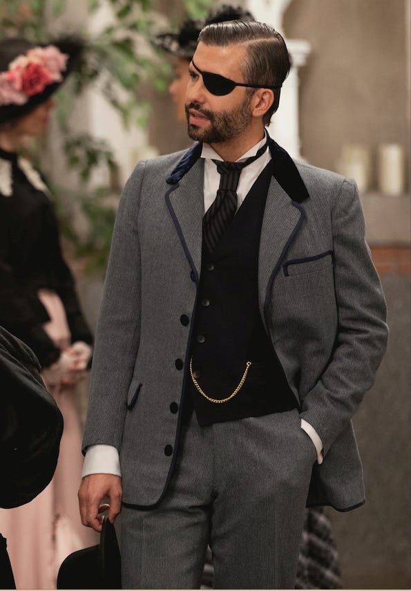 Suit, Clothing, Formal wear, Blazer, Tuxedo, Outerwear, Fashion, White-collar worker, Facial hair, Eyewear, 