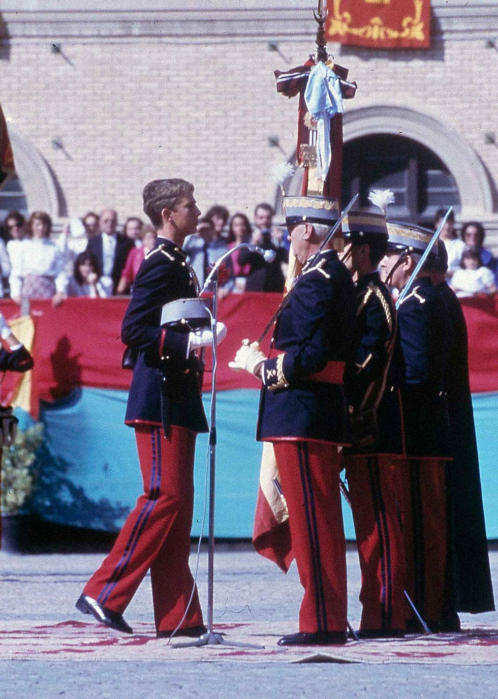 a person in a uniform standing next to a person in a uniform