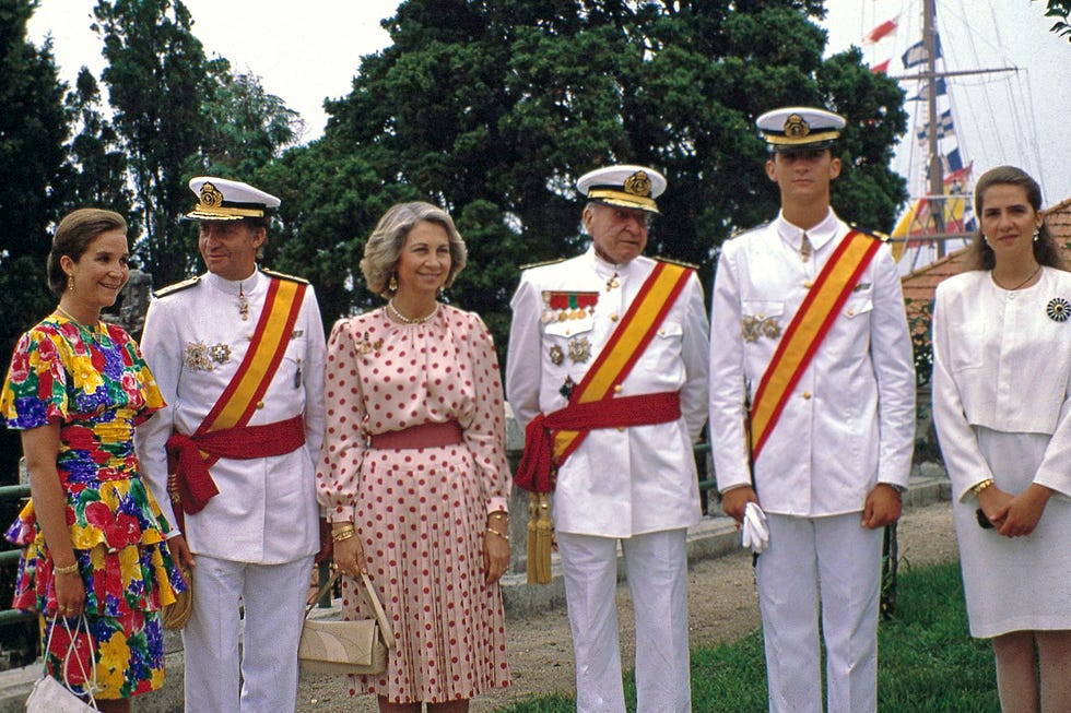 Group of individuals in formal attire at an outdoor event
